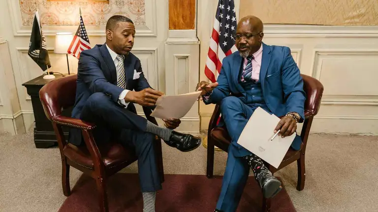 An attorney reviewing recorded lease and lender agreements against a commercial property file