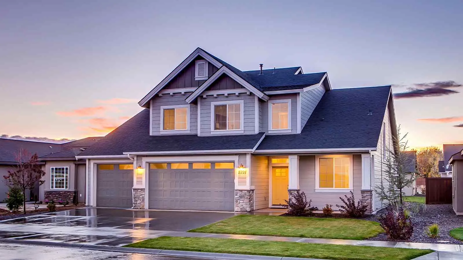 Suburban home at dusk cleared by a thorough lien search
